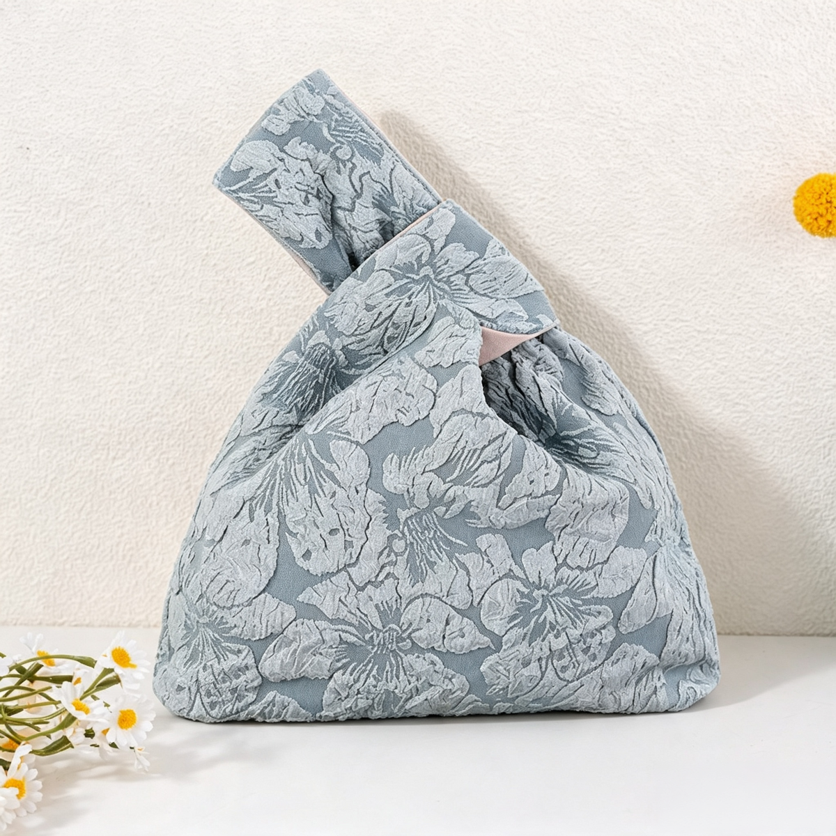 Blue bloom jacquard knot bag with embossed floral