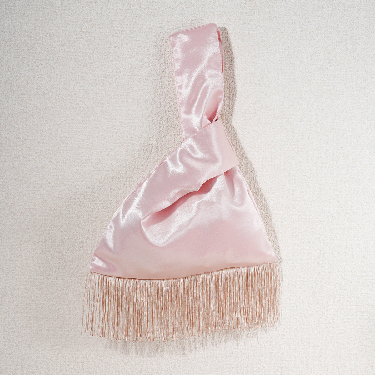 Light pink acetate satin Japanese knot bag with matching fringe