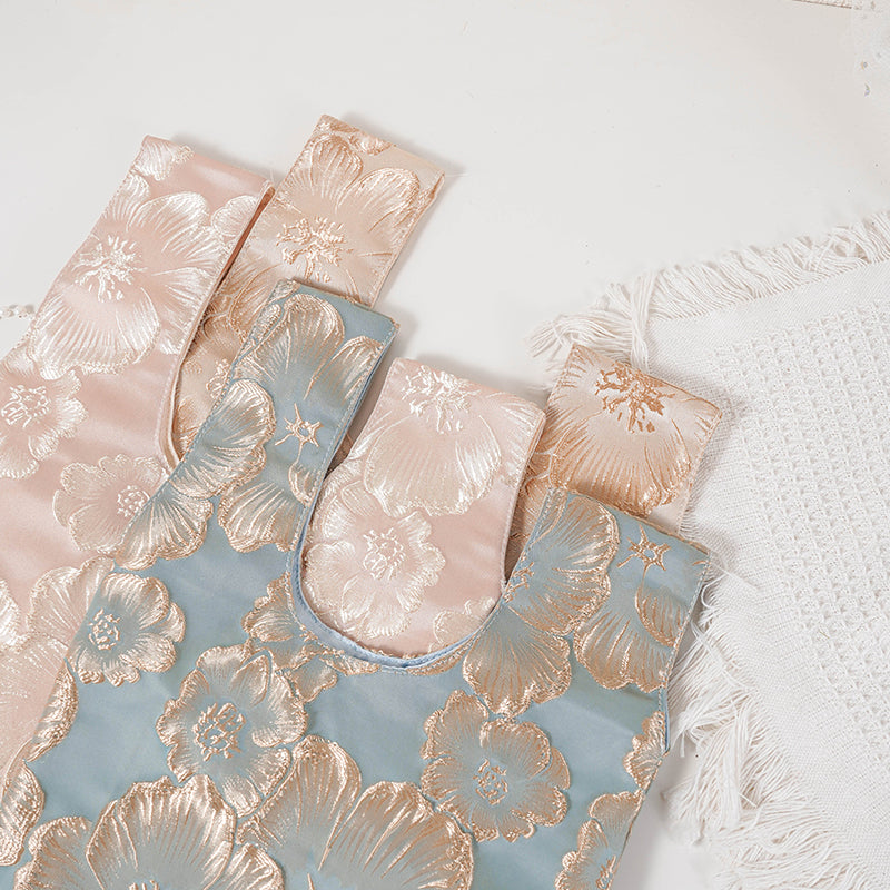 Embossed Camellia Satin Japanese Knot Bag