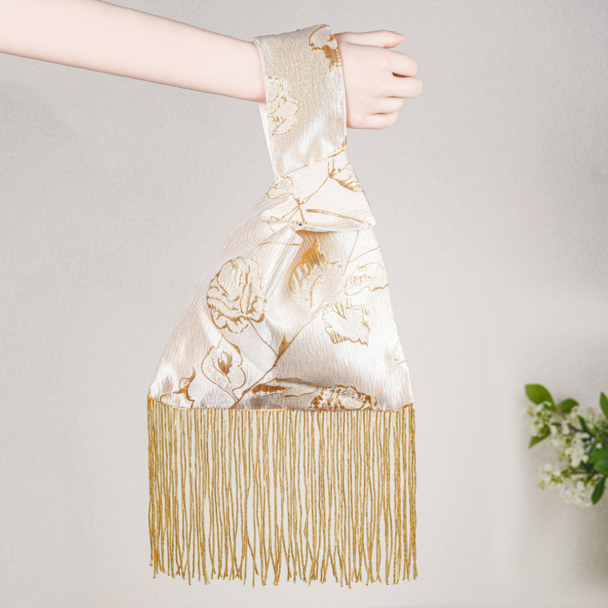 Gold yellow rose knot bag with beaded tassel