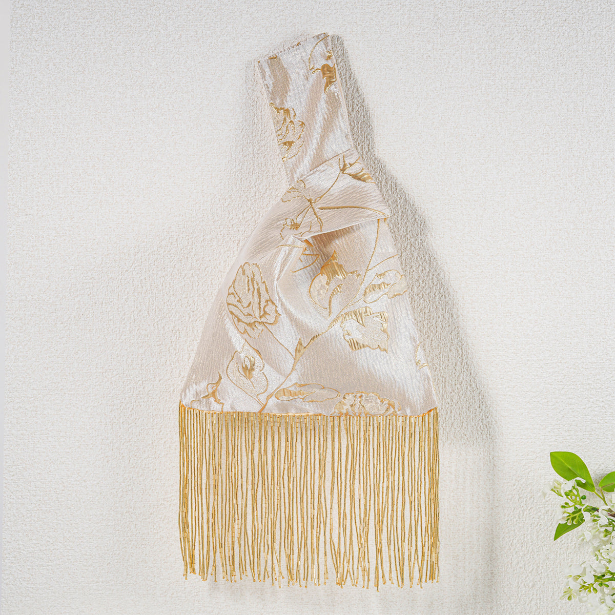 Gold yellow rose tassel bag detail