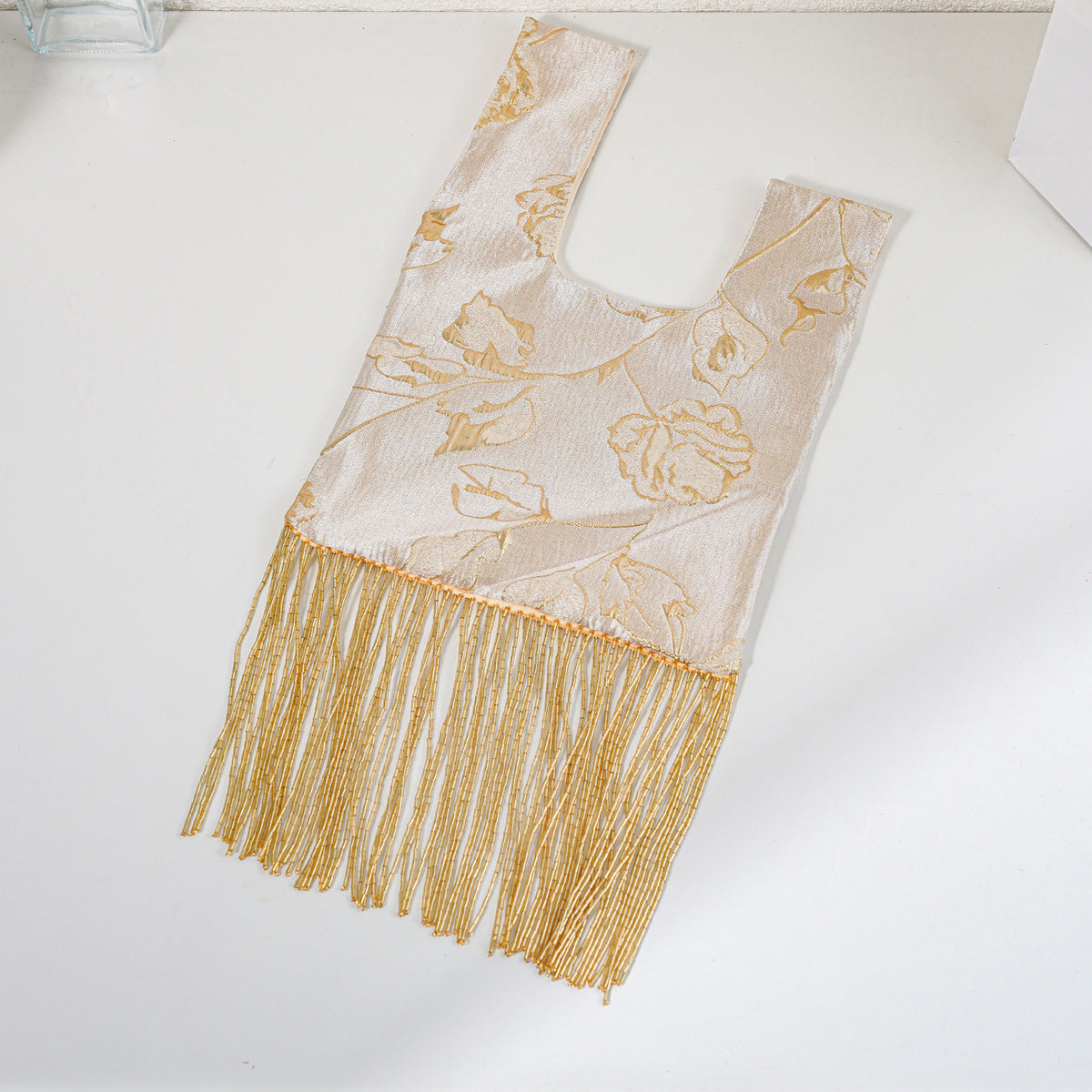 Gold yellow rose tassel bag detail