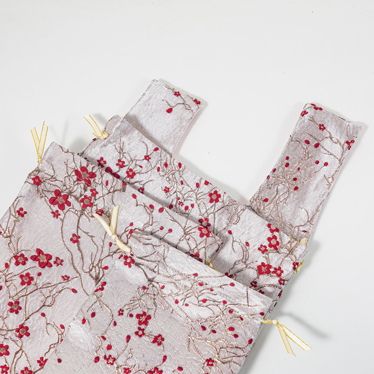 Close-up of the embossed red blossoms