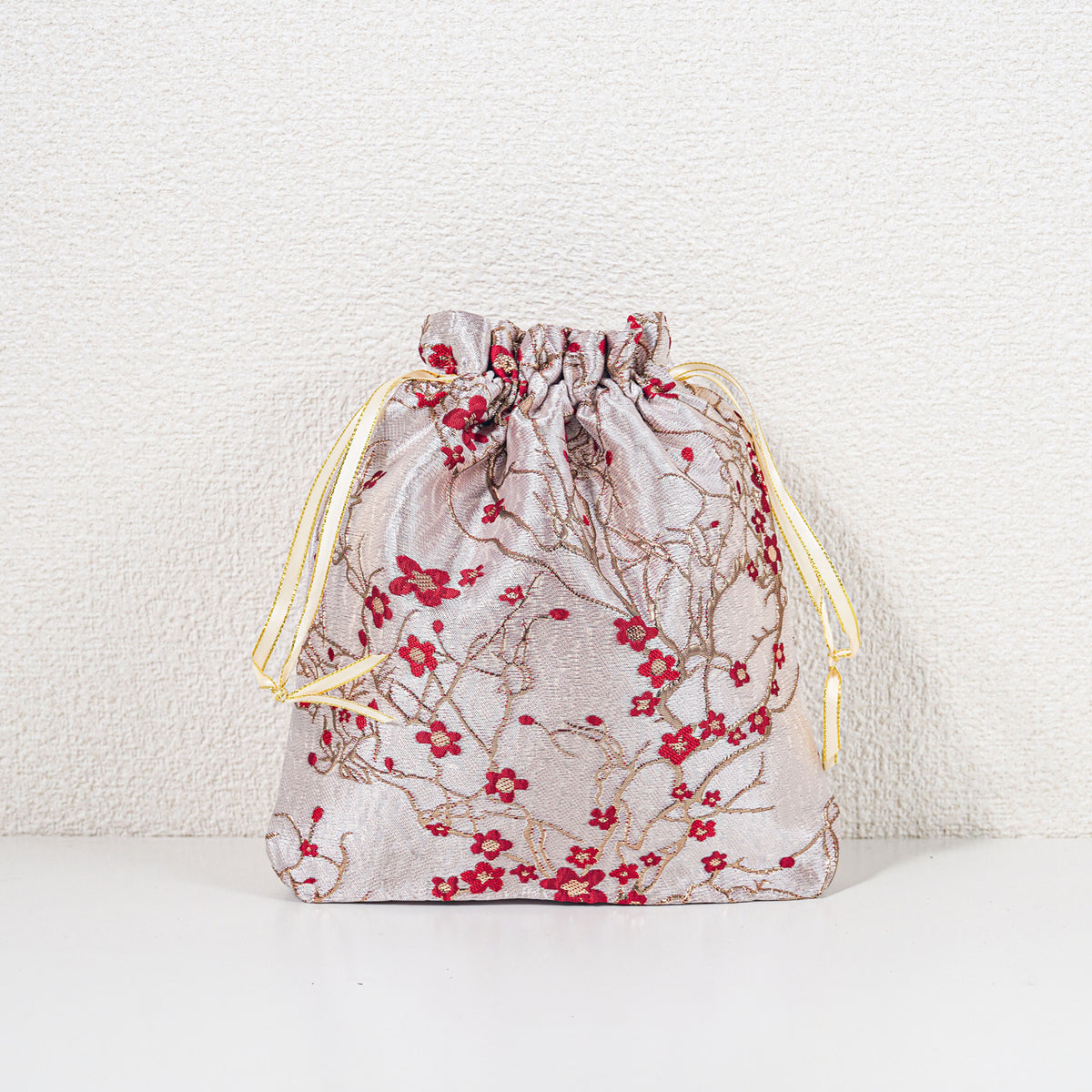 Medium winter blossom drawstring gift bag, red on pale champagne