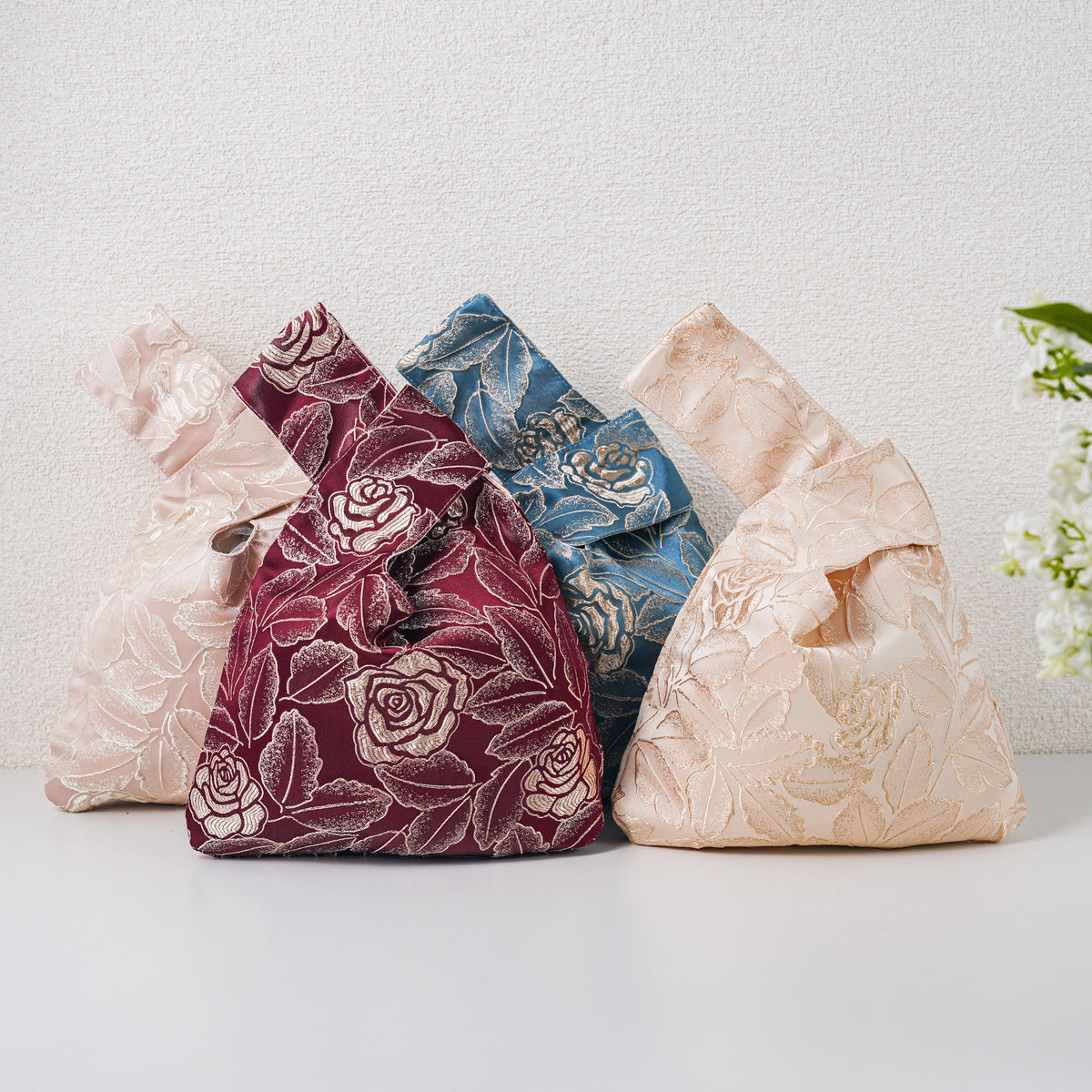 Four vintage rose knot bags