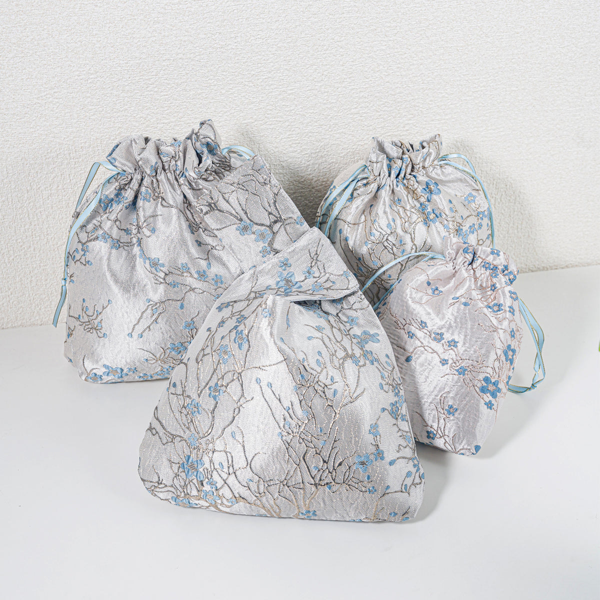 Blue winter blossom knot bag with matching gift bags, sold separately