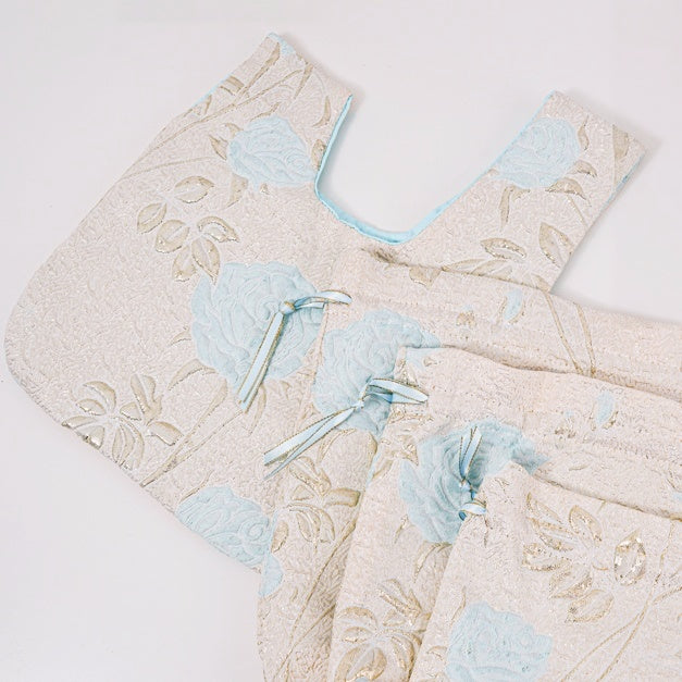 Flat lay showing the woven rose pattern