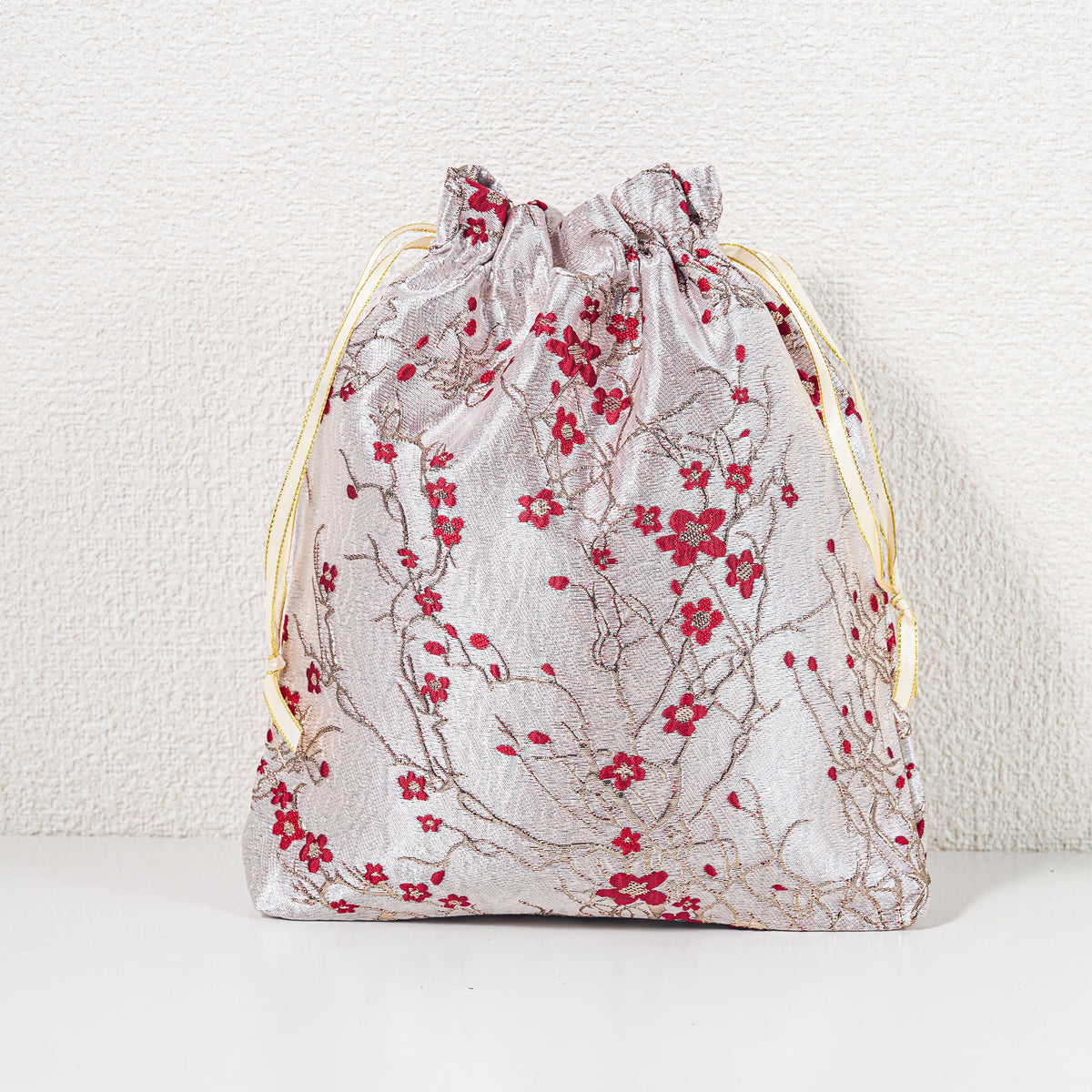 Large winter blossom drawstring gift bag, red on pale champagne