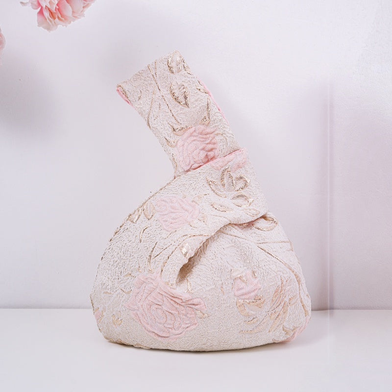 Knot bag with pink long-stem roses
