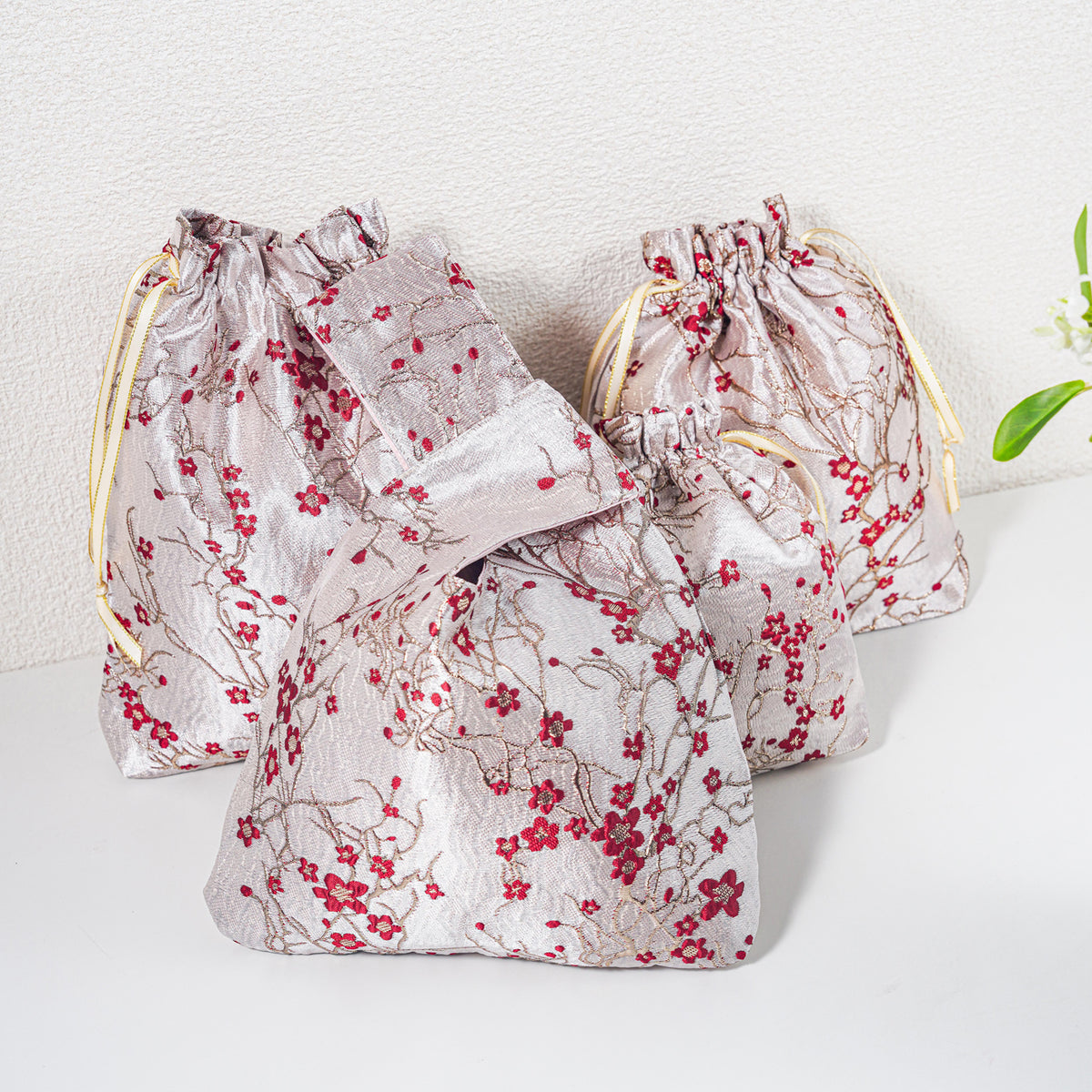 Red winter blossom knot bag with matching gift bags, sold separately