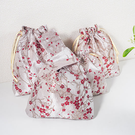 Red winter blossom knot bag with matching gift bags, sold separately