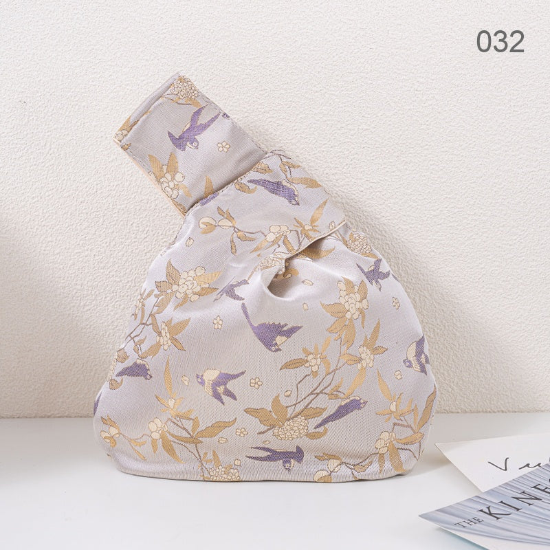 032 Champagne Bird Japanese knot wrist bag