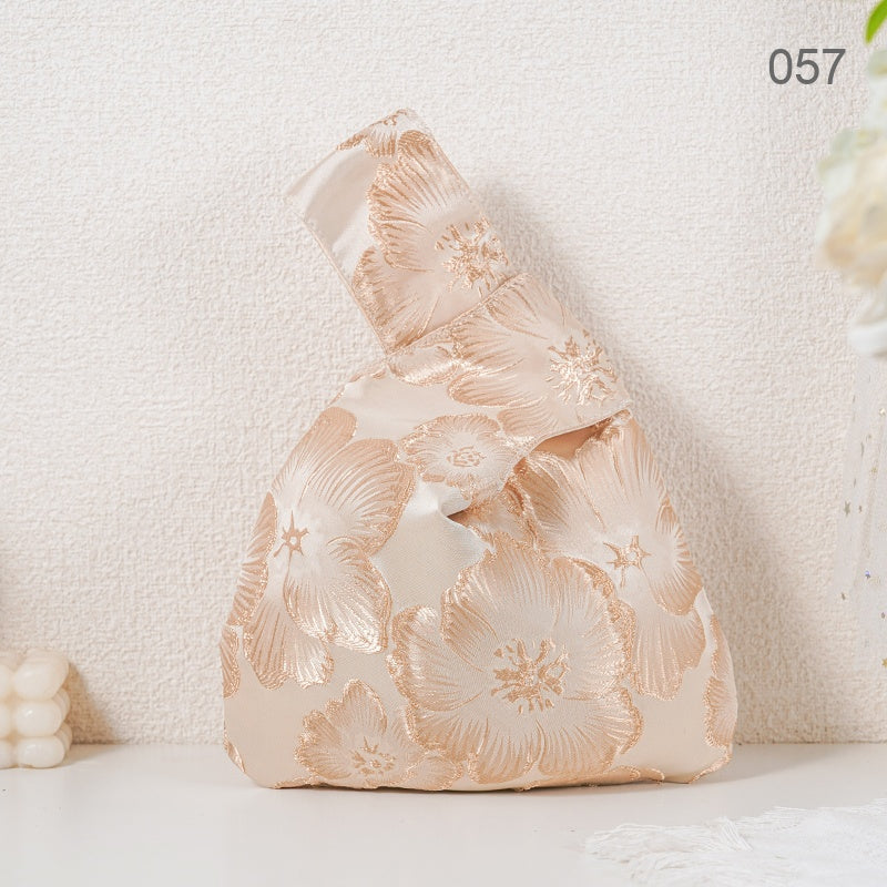 057 Gold Camellia Japanese knot wrist bag