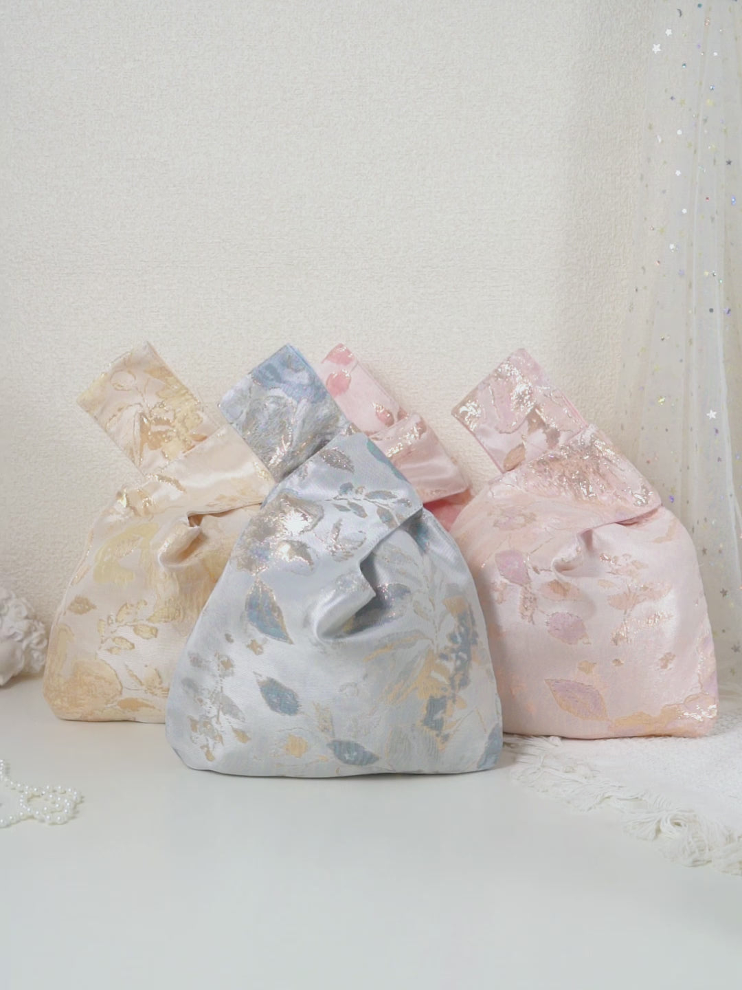 Metallic floral knot bag color options; each bag sold individually