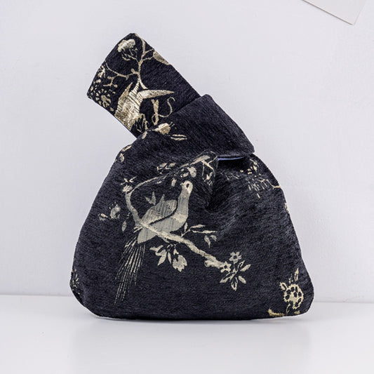 Black gold bird jacquard knot bag with metallic motif