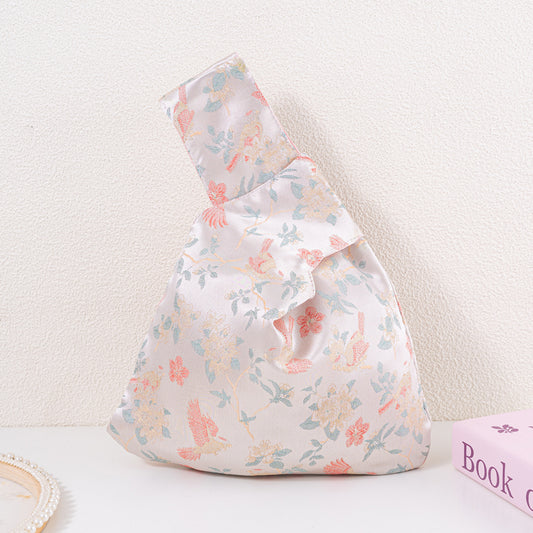 Bird floral brocade knot bag with nature motif