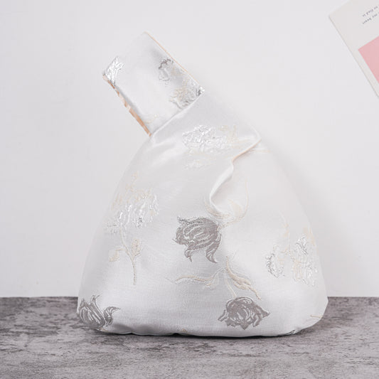 White peony satin knot bag with metallic jacquard floral