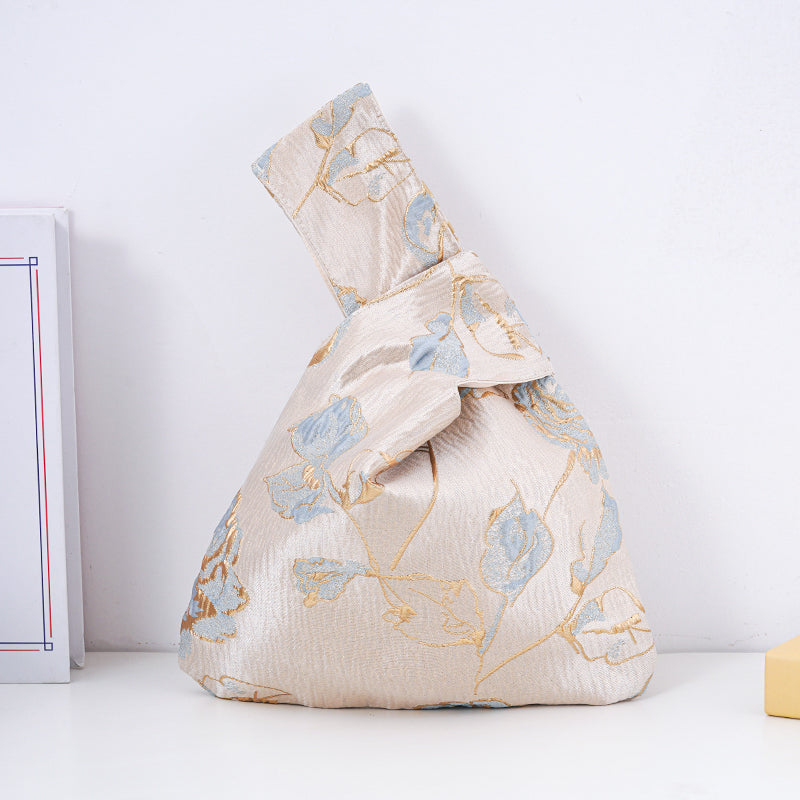 Gold blue rose satin knot bag with rose branch motif