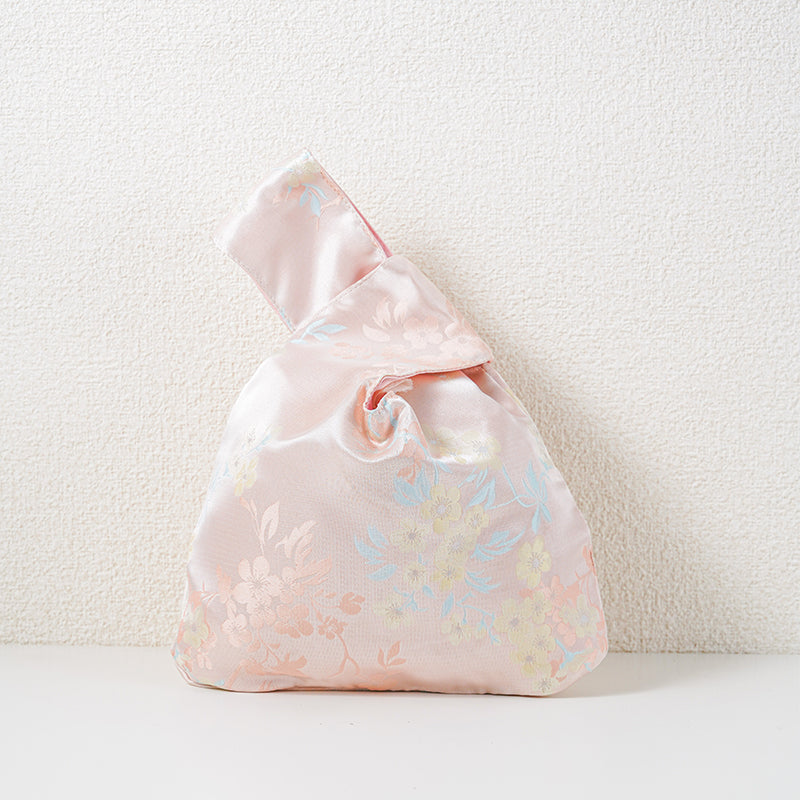 Pink blossom brocade knot bag with peach blossom jacquard