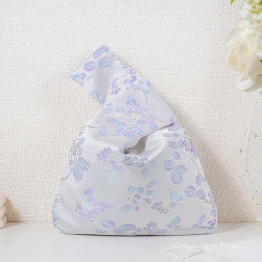 Purple blossom brocade knot bag with lilac sprigs